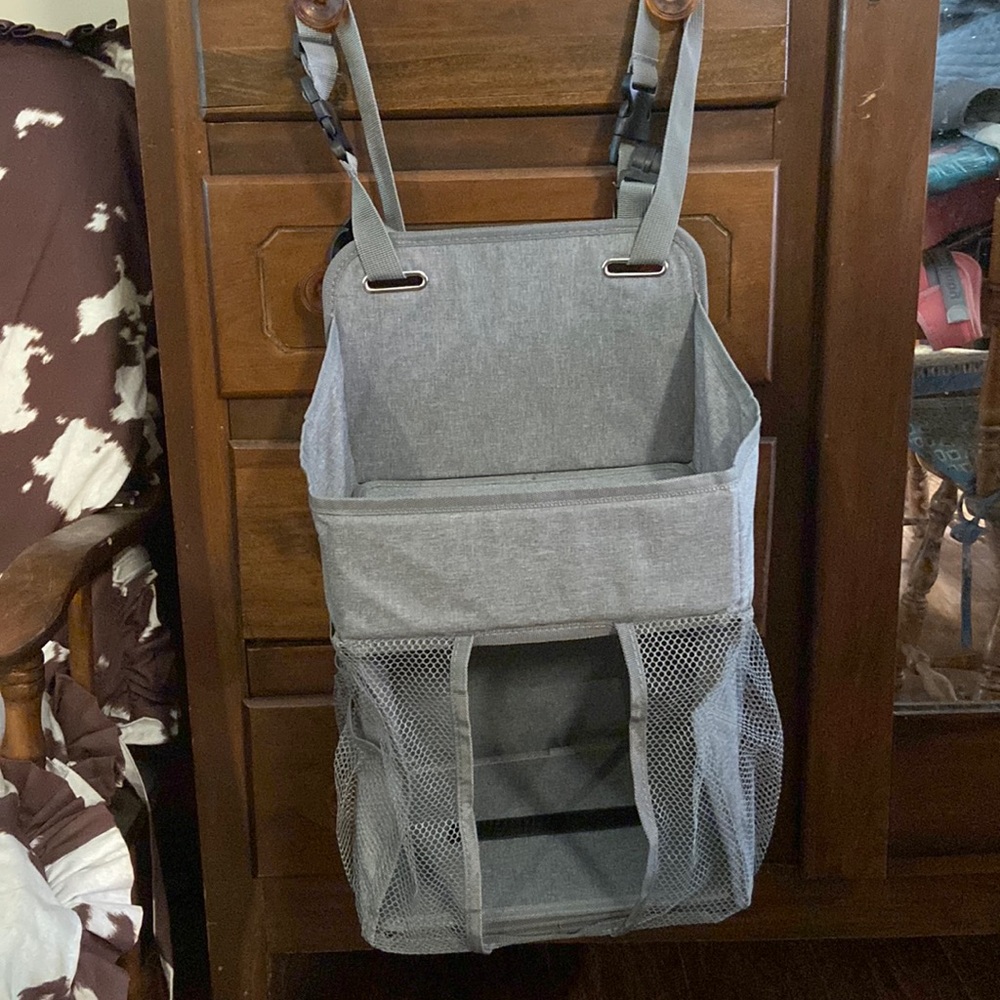 Hanging diaper caddy NWOT. Never used. Grey